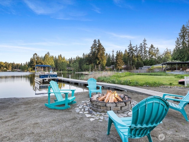 31707 W Lake Ketchum Rd, Stanwood, WA 98292 - dock with an outdoor fire pit, a water view, and a yard