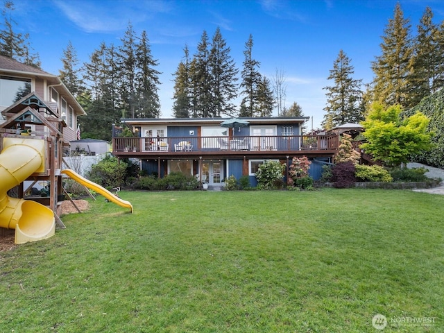 31707 W Lake Ketchum Rd, Stanwood, WA 98292 - rear view of house featuring french doors, a yard, a playground, and a wooden deck
