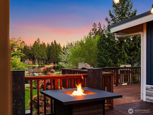 31707 W Lake Ketchum Rd, Stanwood, WA 98292 - deck at dusk with a fire pit