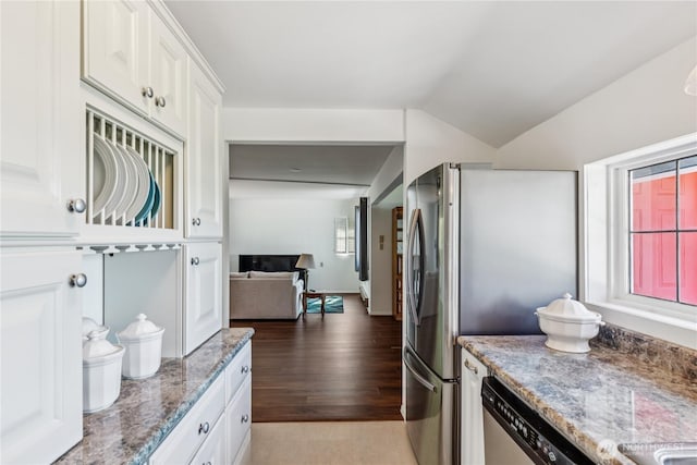 4448 S Shore Dr, Anacortes, WA 98221 - kitchen featuring white cabinetry, light wood-style flooring, light stone countertops, vaulted ceiling, and freestanding refrigerator
