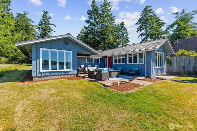 4448 S Shore Dr, Anacortes, WA 98221 - back of property featuring an outdoor hangout area, board and batten siding, and a patio