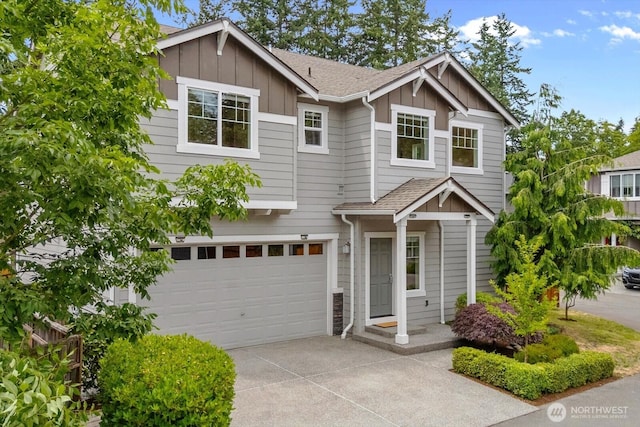 14222 56th Pl W, Edmonds, WA 98026 - view of front of home featuring board and batten siding, concrete driveway, an attached garage, and a shingled roof