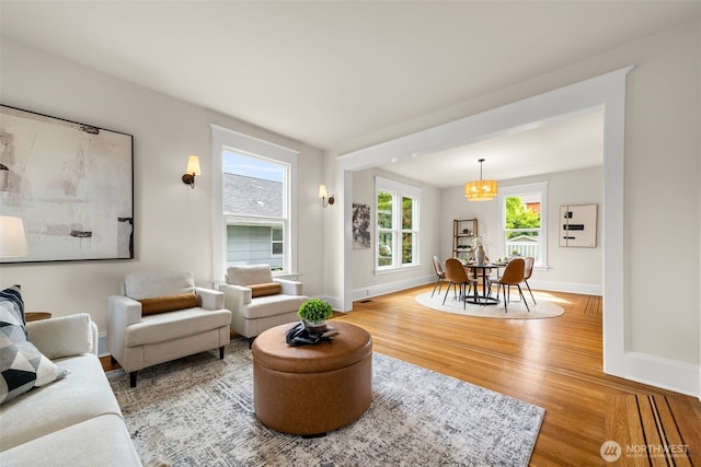 8251 Densmore Ave N, Seattle, WA 98103 - living area with wood finished floors and a chandelier