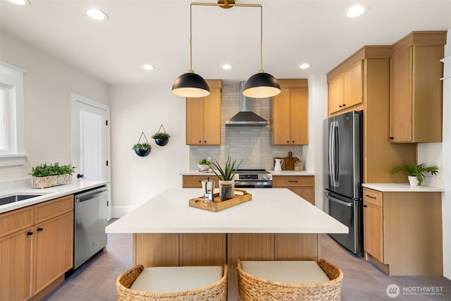 8251 Densmore Ave N, Seattle, WA 98103 - kitchen featuring wall chimney range hood, appliances with stainless steel finishes, light countertops, backsplash, and recessed lighting