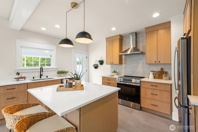 8251 Densmore Ave N, Seattle, WA 98103 - kitchen with wall chimney range hood, appliances with stainless steel finishes, decorative backsplash, a center island, and light countertops