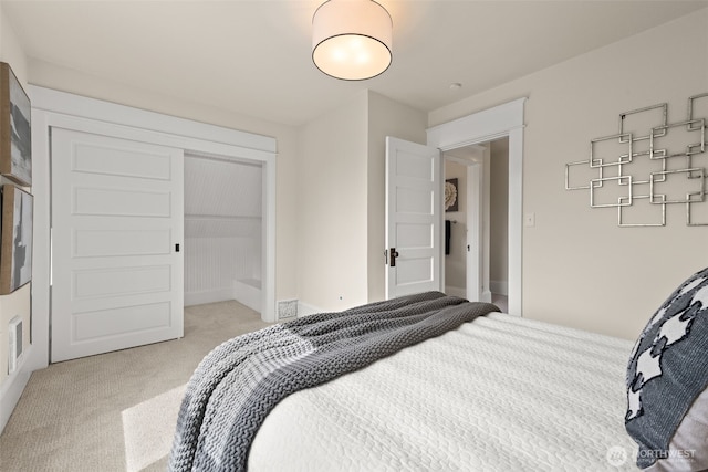 8251 Densmore Ave N, Seattle, WA 98103 - bedroom featuring light carpet and a closet