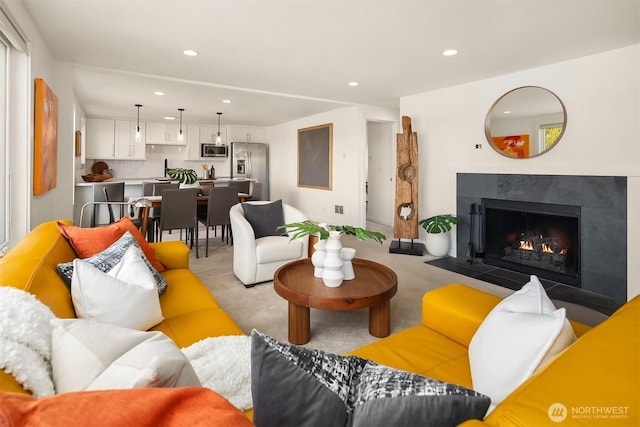 2301 Fairview Ave E Unit 301, Seattle, WA 98102 - living area featuring light carpet, recessed lighting, and a fireplace with flush hearth