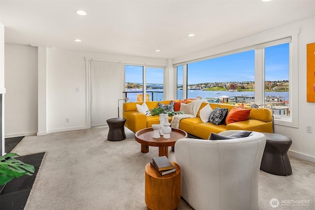 2301 Fairview Ave E Unit 301, Seattle, WA 98102 - carpeted living room featuring a water view and recessed lighting