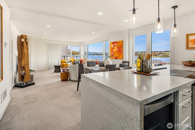 2301 Fairview Ave E Unit 301, Seattle, WA 98102 - kitchen with beverage cooler, a water view, recessed lighting, open floor plan, and decorative light fixtures