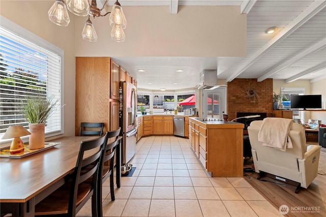 1220 SE 2nd St, East Wenatchee, WA 98802 - kitchen featuring stainless steel appliances, beam ceiling, light tile patterned floors, open floor plan, and island range hood