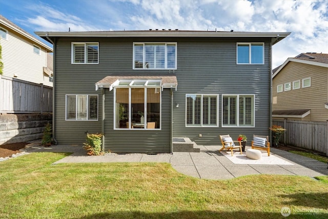 1206 S 36th Pl, Renton, WA 98055 - back of property featuring a patio area and a fenced backyard