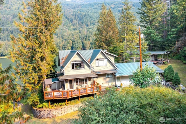 9204 Silver Lake Rd, Maple Falls, WA 98266 - rear view of house with a forest view, a deck, and a metal roof