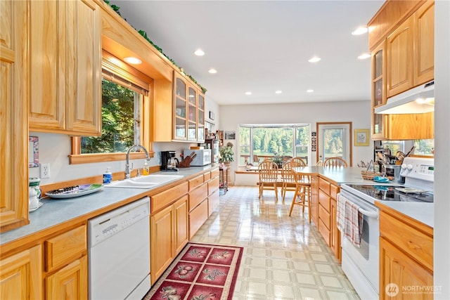 9204 Silver Lake Rd, Maple Falls, WA 98266 - kitchen featuring white appliances, under cabinet range hood, glass insert cabinets, light countertops, and recessed lighting