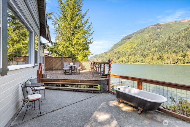 9204 Silver Lake Rd, Maple Falls, WA 98266 - view of patio featuring a deck with water view and a wooded view