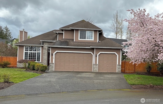 12312 9th St E, Edgewood, WA 98372 - view of front facade with an attached garage, driveway, a chimney, and roof with shingles