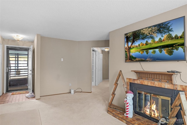 1541 Sheridan Unit C2, Bremerton, WA 98310 - living room featuring carpet, a textured ceiling, and a glass covered fireplace
