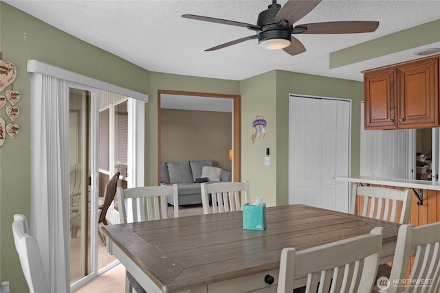 1541 Sheridan Unit C2, Bremerton, WA 98310 - dining area with a ceiling fan and a textured ceiling