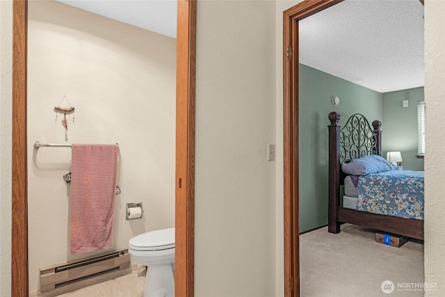 1541 Sheridan Unit C2, Bremerton, WA 98310 - bathroom featuring baseboard heating, a textured ceiling, and ensuite bath