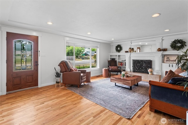 5620 N 23rd St, Tacoma, WA 98406 - living room with light wood-style flooring, recessed lighting, and a fireplace