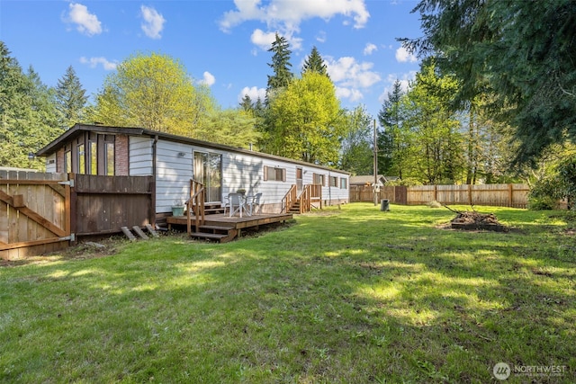 2641 Scotlac Dr SW, Olympia, WA 98512 - rear view of property featuring a wooden deck, a fenced backyard, and view of scattered trees