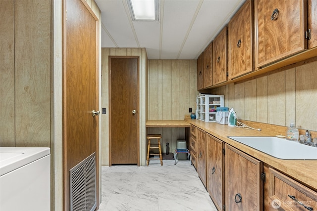 2641 Scotlac Dr SW, Olympia, WA 98512 - laundry area featuring cabinet space, light marble finish floors, washer / dryer, and a desk