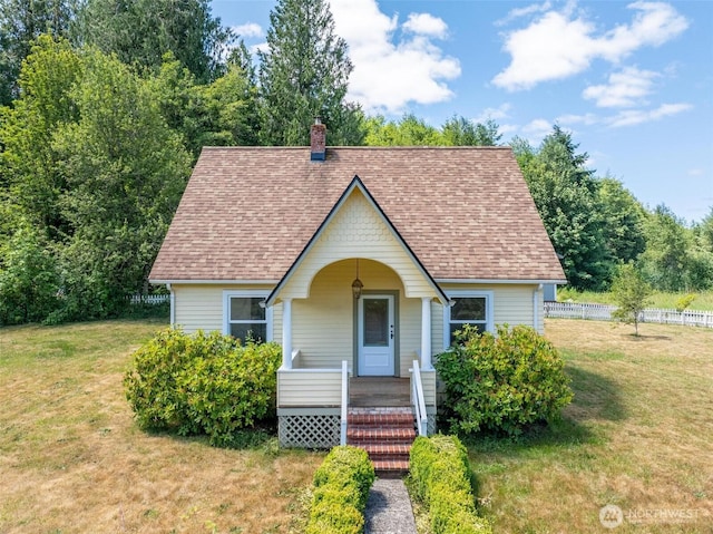 1129 Bunker Creek Rd, Chehalis, WA 98532 - view of front of house with a porch, a chimney, and a shingled roof