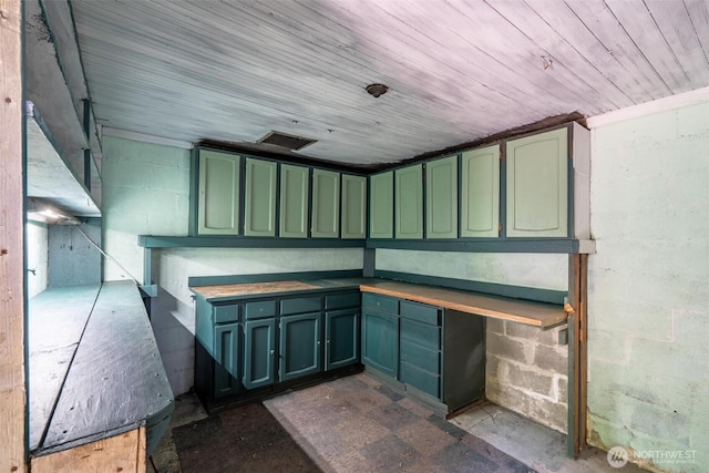 1129 Bunker Creek Rd, Chehalis, WA 98532 - misc room with unfinished concrete floors, concrete block wall, and wood ceiling