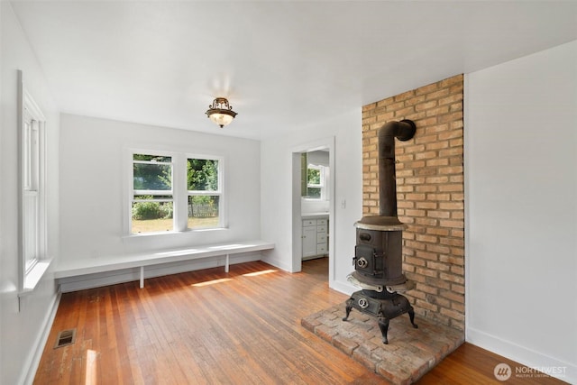1129 Bunker Creek Rd, Chehalis, WA 98532 - unfurnished living room with a wood stove and wood-type flooring