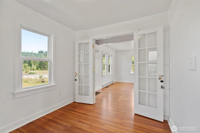 1129 Bunker Creek Rd, Chehalis, WA 98532 - foyer entrance featuring french doors, wood finished floors, and a baseboard radiator