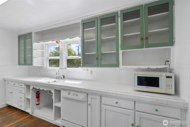 1129 Bunker Creek Rd, Chehalis, WA 98532 - kitchen with white appliances, dark wood-type flooring, wainscoting, green cabinets, and glass insert cabinets