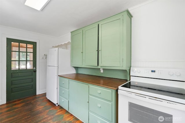 1129 Bunker Creek Rd, Chehalis, WA 98532 - kitchen featuring white appliances, green cabinets, dark countertops, dark wood-style floors, and ornamental molding