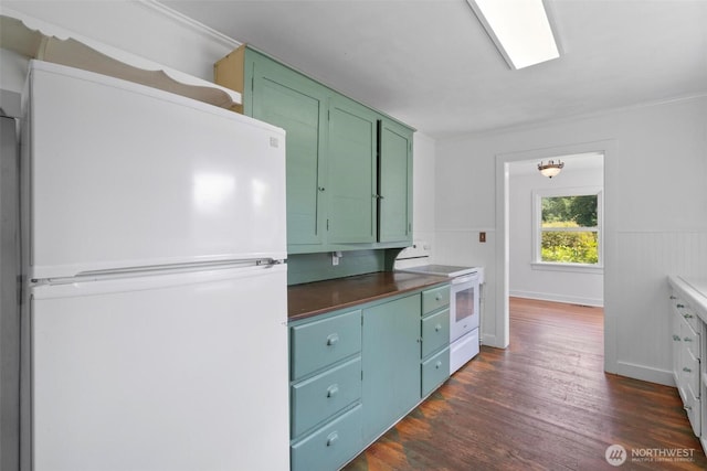 1129 Bunker Creek Rd, Chehalis, WA 98532 - kitchen with white appliances, dark wood-style flooring, green cabinets, ornamental molding, and wainscoting