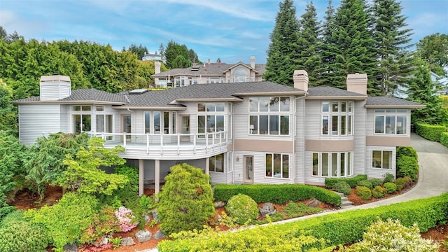 16833 SE 57th Pl, Bellevue, WA 98006 - back of house with a chimney and a balcony
