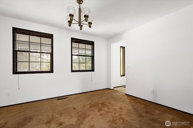 1078 NW Kitsap Ter, Oak Harbor, WA 98277 - carpeted empty room with a chandelier and baseboards