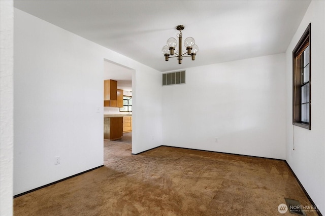 1078 NW Kitsap Ter, Oak Harbor, WA 98277 - unfurnished room with a chandelier and carpet