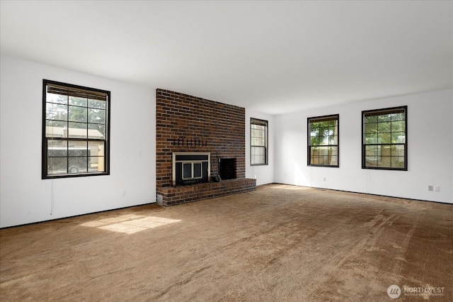 1078 NW Kitsap Ter, Oak Harbor, WA 98277 - unfurnished living room featuring carpet and a brick fireplace