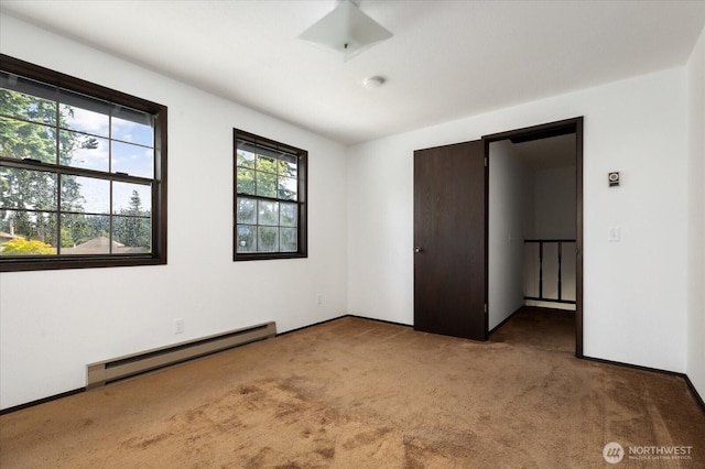 1078 NW Kitsap Ter, Oak Harbor, WA 98277 - unfurnished bedroom with a baseboard radiator and carpet floors