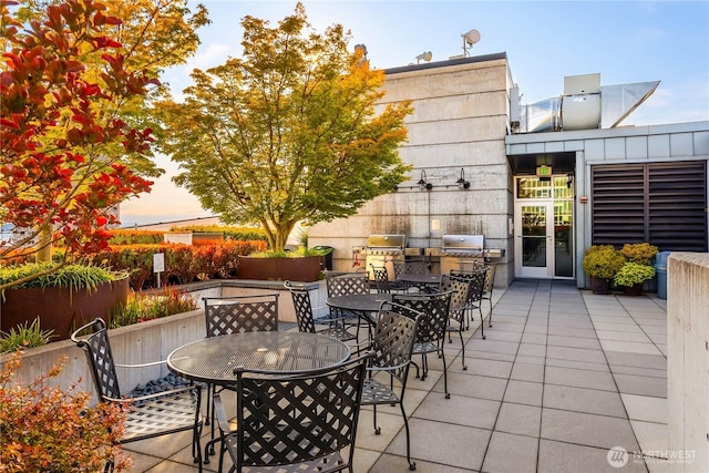 2720 3rd Ave Unit 412, Seattle, WA 98121 - view of patio / terrace featuring outdoor dining space and exterior kitchen