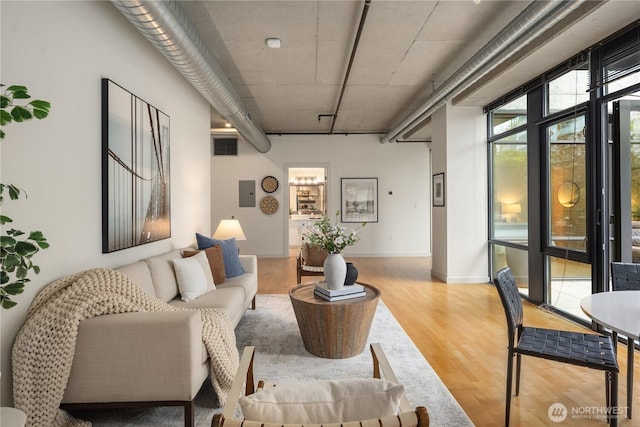 2720 3rd Ave Unit 412, Seattle, WA 98121 - living room featuring wood finished floors