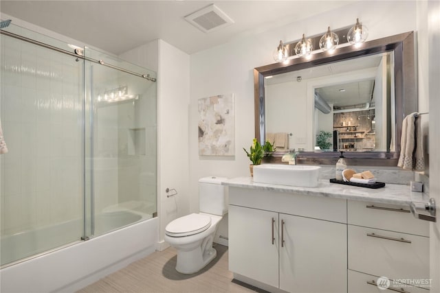 2720 3rd Ave Unit 412, Seattle, WA 98121 - full bath with vanity and shower / bath combination with glass door