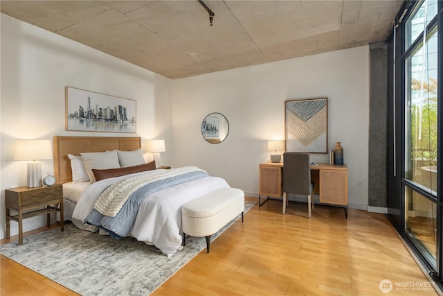2720 3rd Ave Unit 412, Seattle, WA 98121 - bedroom with wood finished floors and a desk