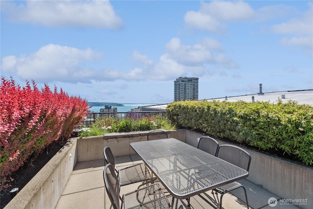 2720 3rd Ave Unit 412, Seattle, WA 98121 - view of patio with a water view and outdoor dining area