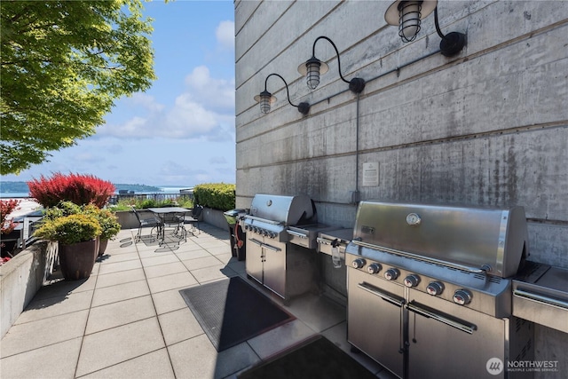 2720 3rd Ave Unit 412, Seattle, WA 98121 - view of patio with outdoor dining area and area for grilling
