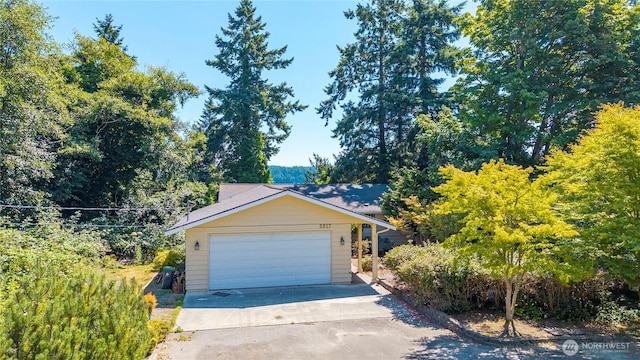 5017 Harbor Hills Dr, Freeland, WA 98249 - view of front facade with driveway and an attached garage