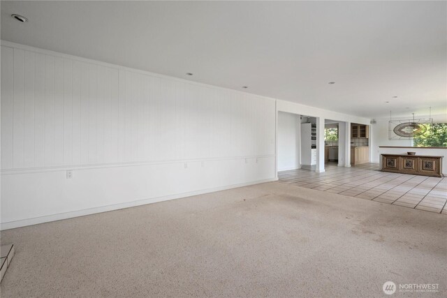 5017 Harbor Hills Dr, Freeland, WA 98249 - unfurnished living room featuring tile patterned floors and carpet floors