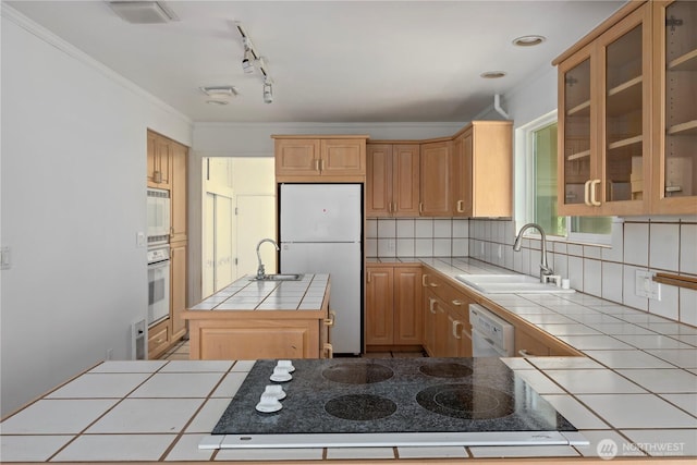 5017 Harbor Hills Dr, Freeland, WA 98249 - kitchen with tile counters, white appliances, a kitchen island with sink, tasteful backsplash, and glass insert cabinets