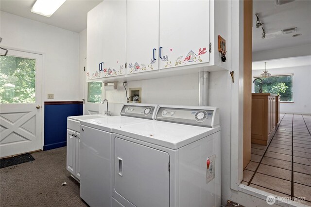 5017 Harbor Hills Dr, Freeland, WA 98249 - laundry area featuring cabinet space, washing machine and dryer, healthy amount of natural light, and rail lighting