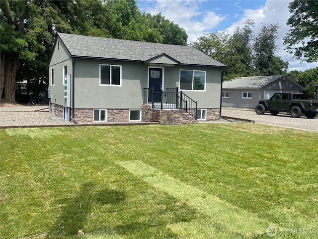 604 SW 4th St, College Place, WA 99324 - view of front of home featuring a front lawn, roof with shingles, and stucco siding