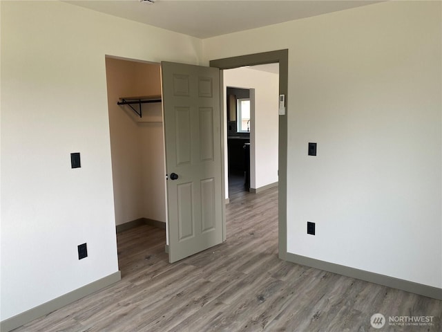604 SW 4th St, College Place, WA 99324 - unfurnished bedroom featuring light wood-style flooring and a closet