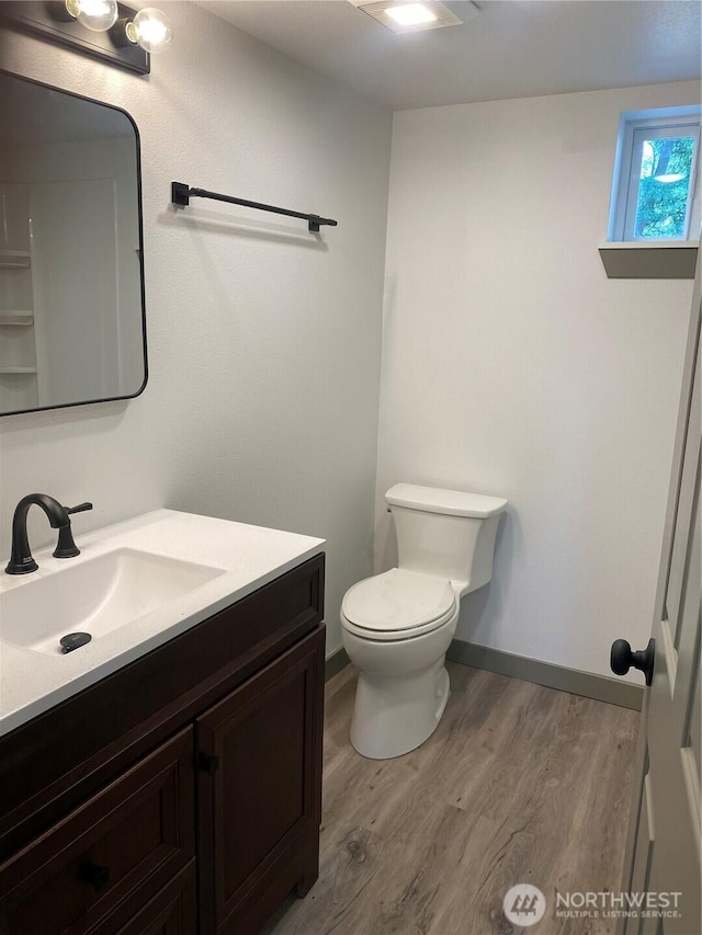 604 SW 4th St, College Place, WA 99324 - half bathroom with vanity and wood finished floors